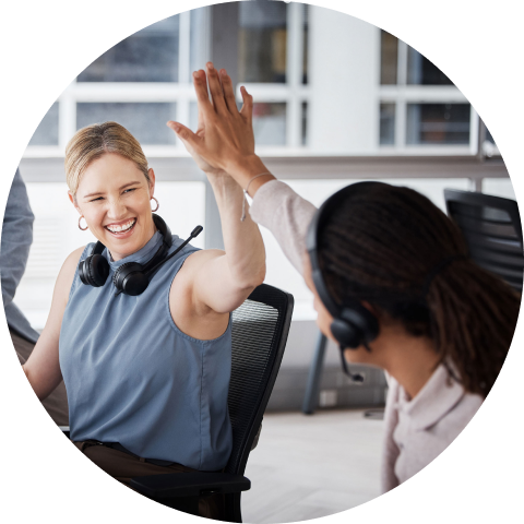 Image of a woman high-fiving a co-worker